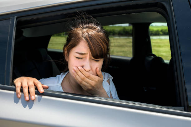 istock young woman getting carsickness. 894194338