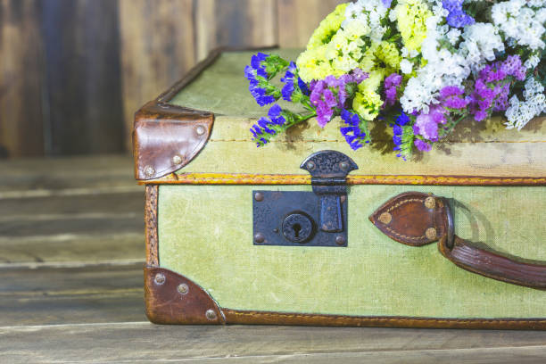 istock Antique suitcase with flowers 894199392