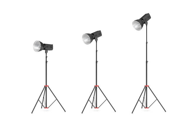 istock 3d rendering of three lights with reflectors with the head turned down and up 894203732