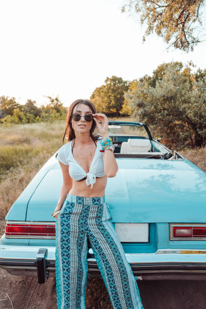 istock Girl posing on a background cabriolet 894206778