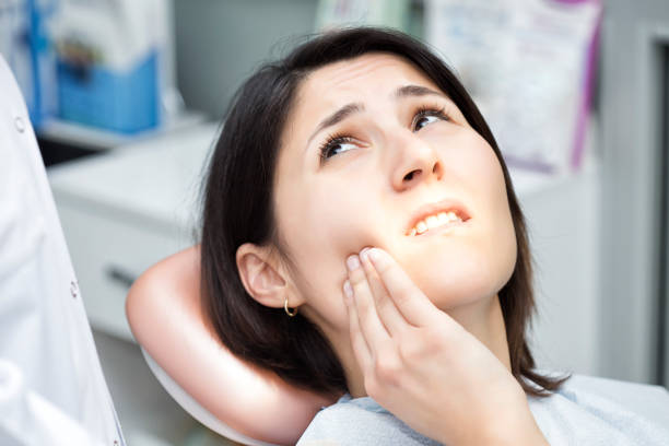 istock Smiling woman at the dentist 894240772