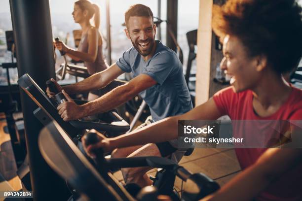 Cheerful Male Athlete Talking To His Friend On Exercising Training In A Health Club Stock Photo - Download Image Now