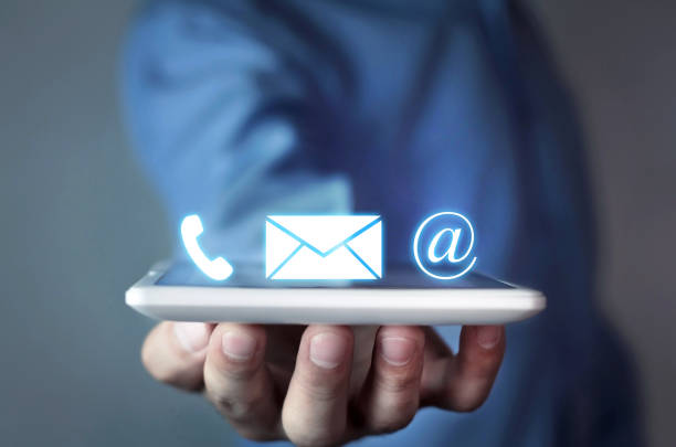 istock Man holding contact icons. 894302452