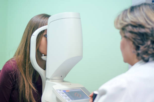 istock Optician with tonometer and patient at eye clinic 894305208