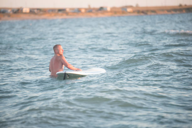 istock A man with SUP at sea 894305530