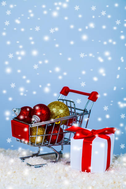 istock Shopping cart with Christmas balls 894315204