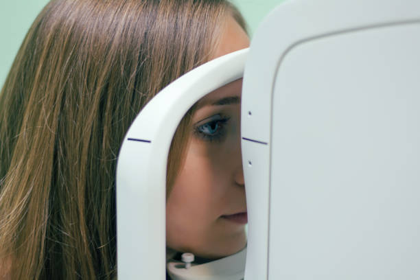 istock Optician with tonometer and patient at eye clinic 894315276