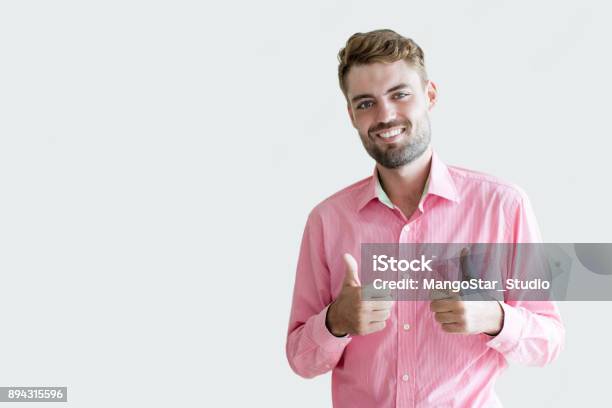 Smiling Young Handsome Man Showing Thumbs Up Stock Photo - Download Image Now - Adult, Adults Only, Advertisement