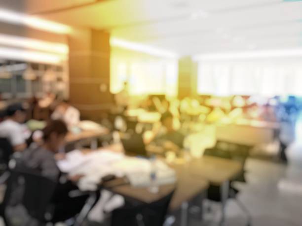 istock blurred image of university students training / reading / searching for books / and preparing for the final examination in modern library at university, blur group of people or researcher 894318390
