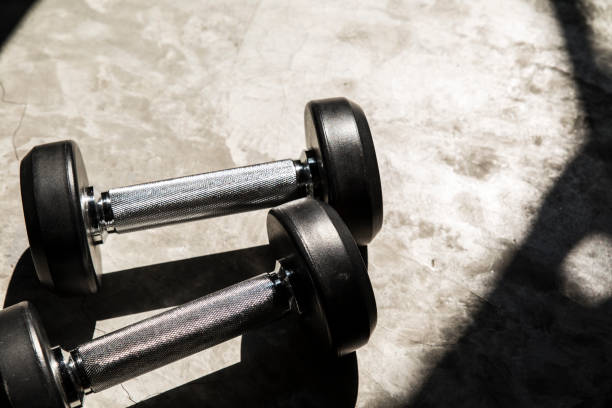istock Close up Dumbbells on floor in Gym 894318578