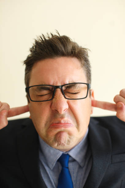 istock Irritated frowning manager annoyed with noise 894322384