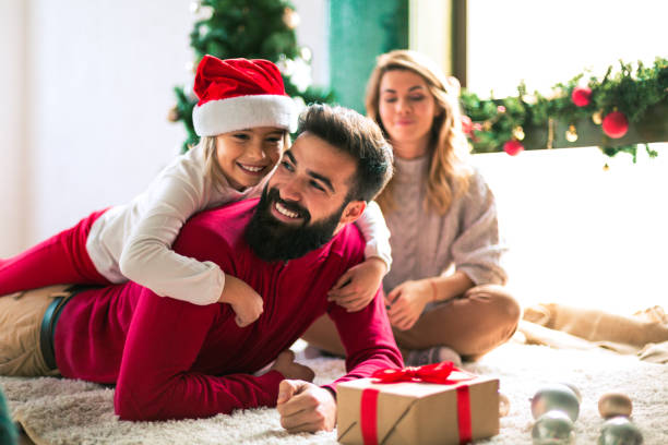 istock Family celebrating Christmas at home. 894331056
