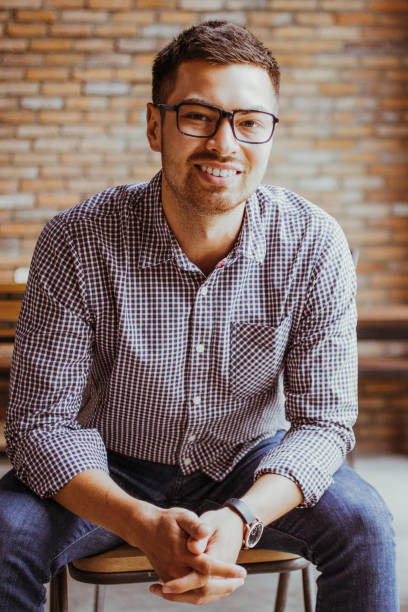 istock Positive Man Sitting at Window in Loft Office 894344628