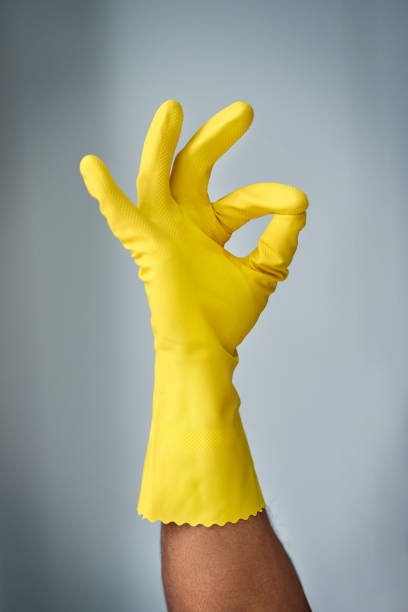 Cropped shot of an unrecognizable man wearing a rubber cleaning glove inside