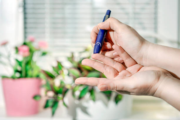 istock A medical test, checking a drop of blood on the sugar level. 894349070