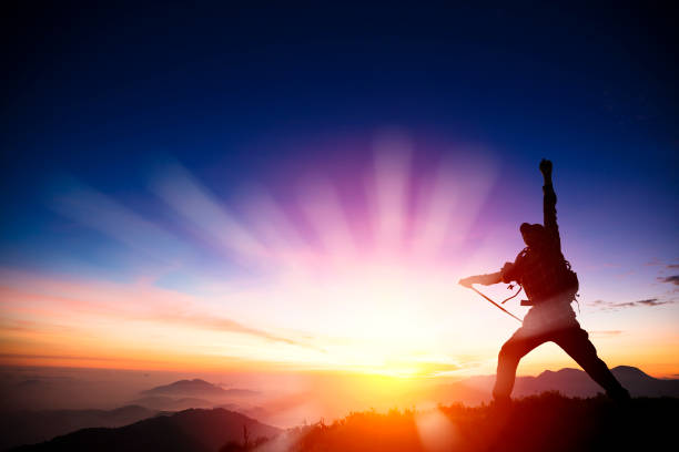 man on the top of mountain watching sunrise