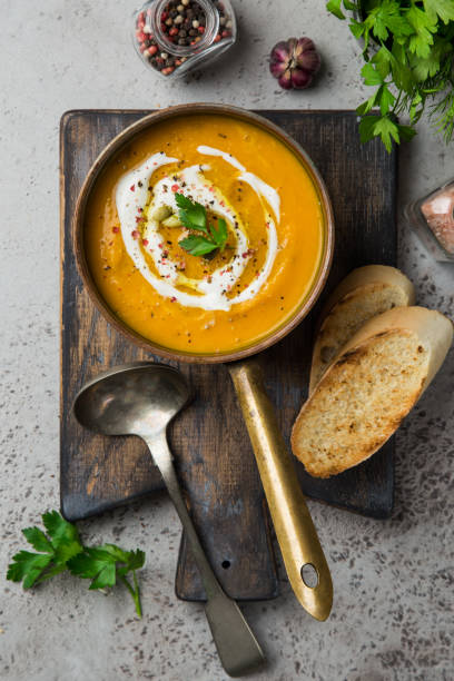 istock autumn pumpkin soup with cream and pumpkin seeds 894361434