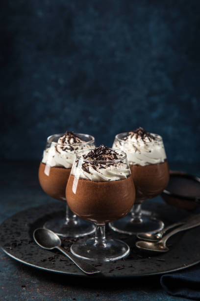 istock chocolate mousse served with whipped cream 894361658