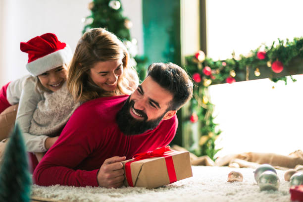 istock Family celebrating Christmas at home. 894369608