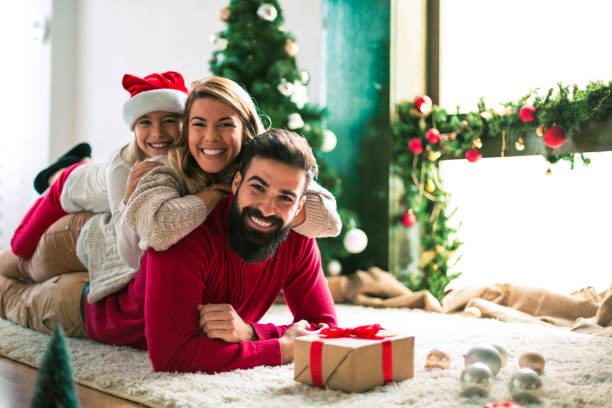 istock Family celebrating Christmas at home. 894371814
