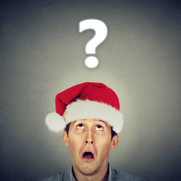 istock Man in Santa hat questioning about gifts 894372228