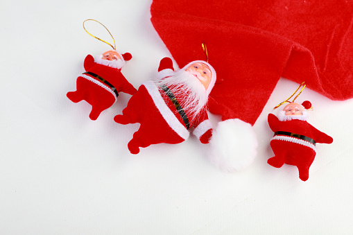 Santa Dolls And Cap On A White Background Stock Photo - Download Image ...