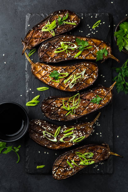 istock glazed grilled eggplants served with sesame seeds and green onion 894372800