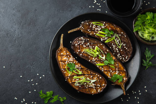 istock glazed grilled eggplants served with sesame seeds and green onion 894372802