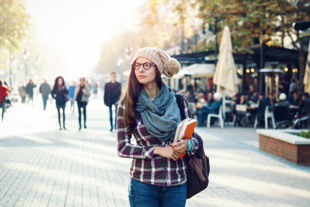 istock Student girl walking on the street 894372996