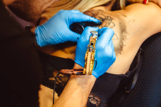 istock master tattoo woman on her back 894378082