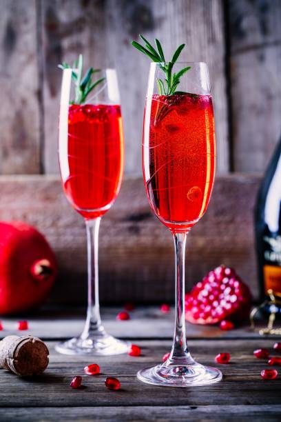 istock Pomegranate champagne mimosa cocktail with rosemary 894378128