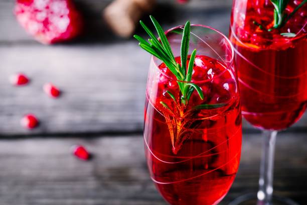 istock Pomegranate champagne mimosa cocktail with rosemary 894378166