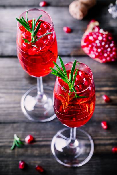 istock Pomegranate champagne mimosa cocktail with rosemary 894378218