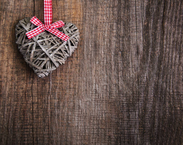 istock Christmas tree branches with heart decoration 894378660