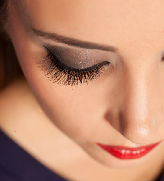 istock Closeup of eyelashes extension. False eyelashes 894378788