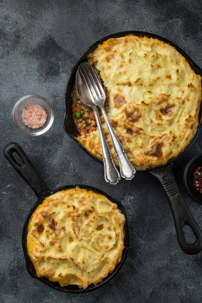 istock shepherd's pie. Minced meat, mashed potatoes and vegetables casserole in cast iron pan 894383360
