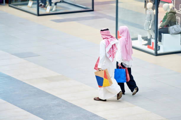 istock Young muslim couple shopping 894386292
