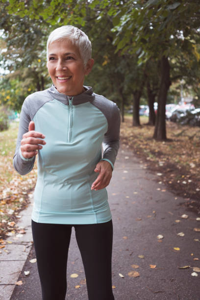 istock Woman jogging outdoors 894386306