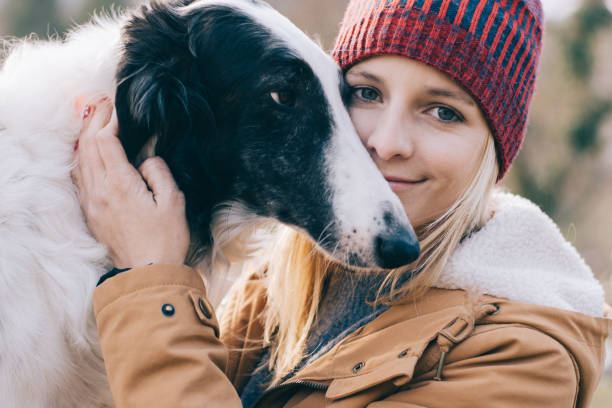 istock Young woman and her dog having fun together. 894391624