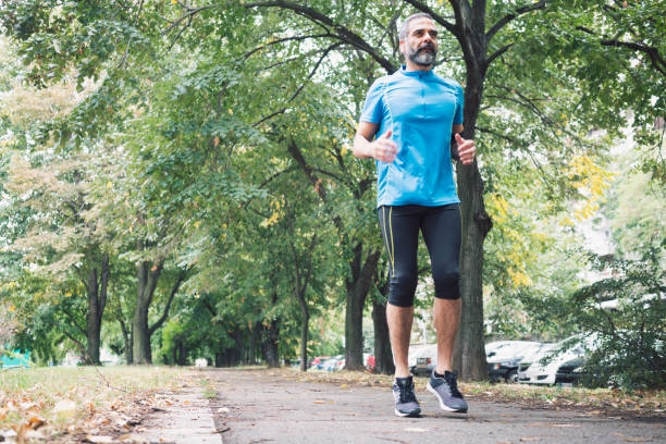 istock Man jogging outdoors 894392620