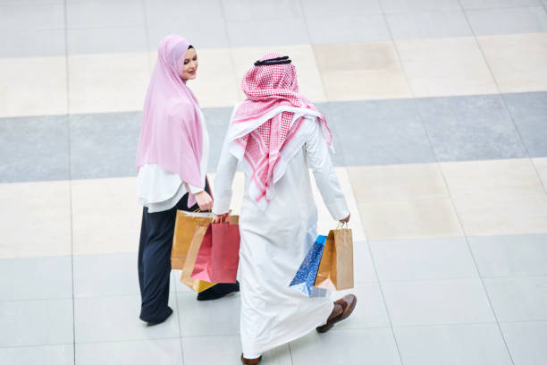 istock Young muslim couple shopping 894393334