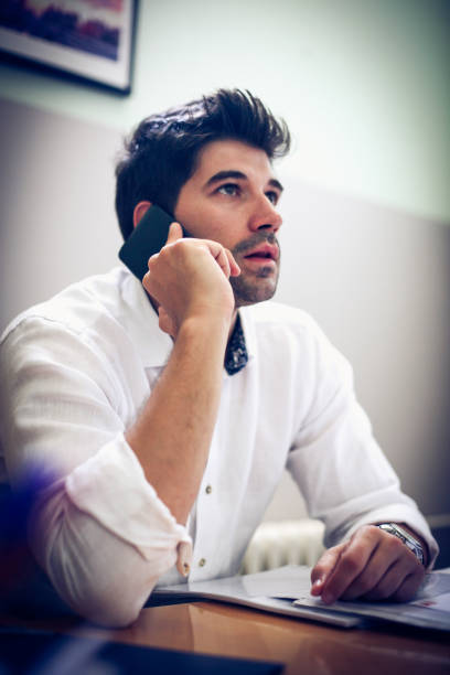 istock Businessman making a phone call. Close up. 894393436