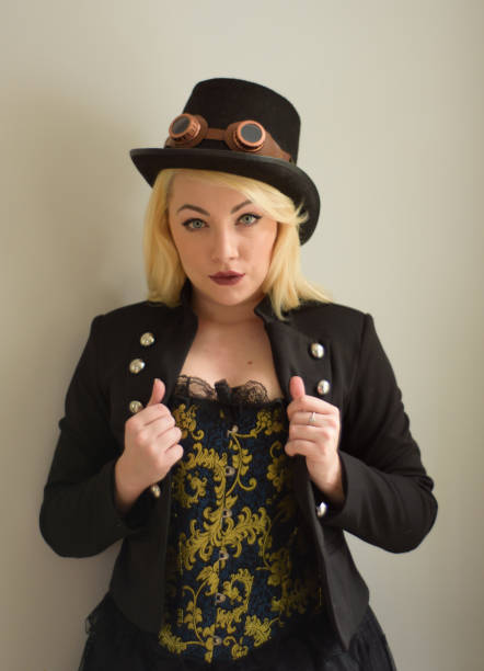 istock Young Steampunk girl holds lapels 894396098