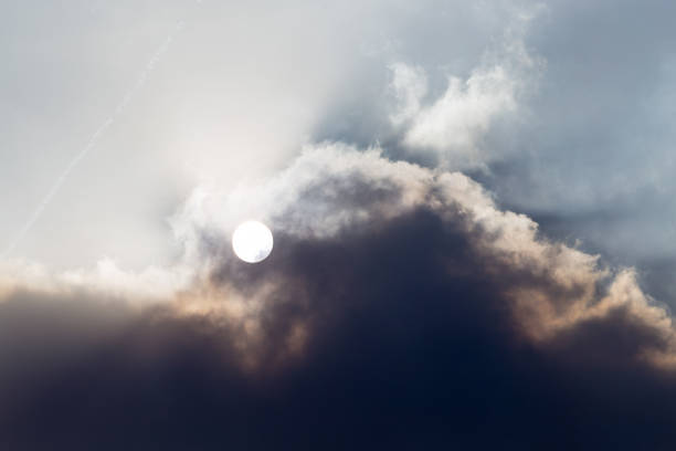 istock Industrial smoke closes the sun in the sky 894396956