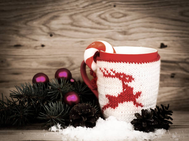 istock Christmas mug with Christmas decorations in wooden background 894397538