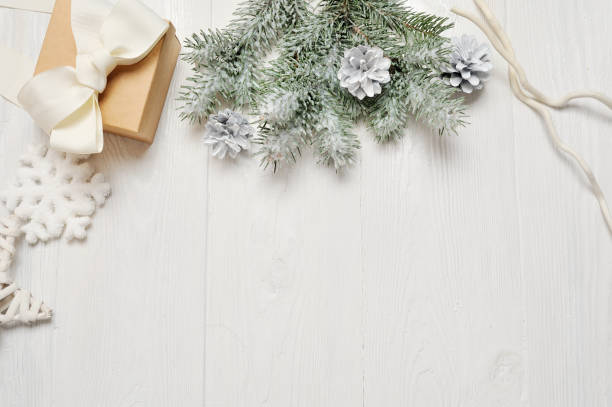 istock Mockup christmas or new year frame composition with space for your text. christmas decorations on white wooden background. holiday and celebration concept for postcard or invitation. top view 894400190