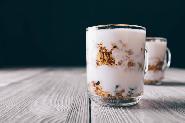 istock Yogurt and muesli in a glass on the table 894400558