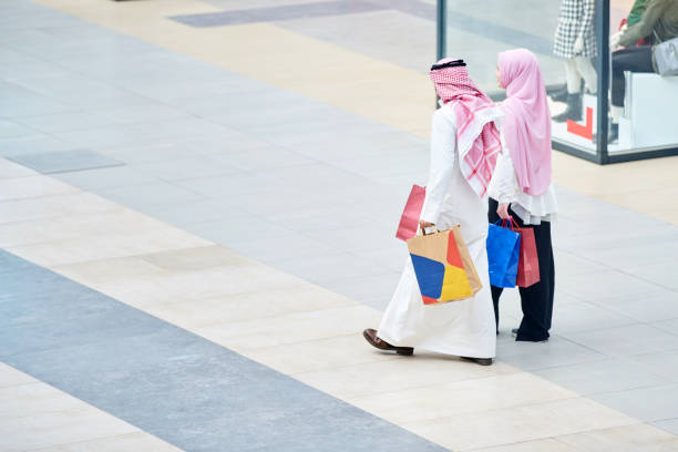 istock Young muslim couple shopping 894405622