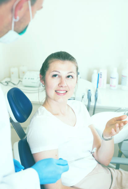 istock Female is consulting with dentist 894405986