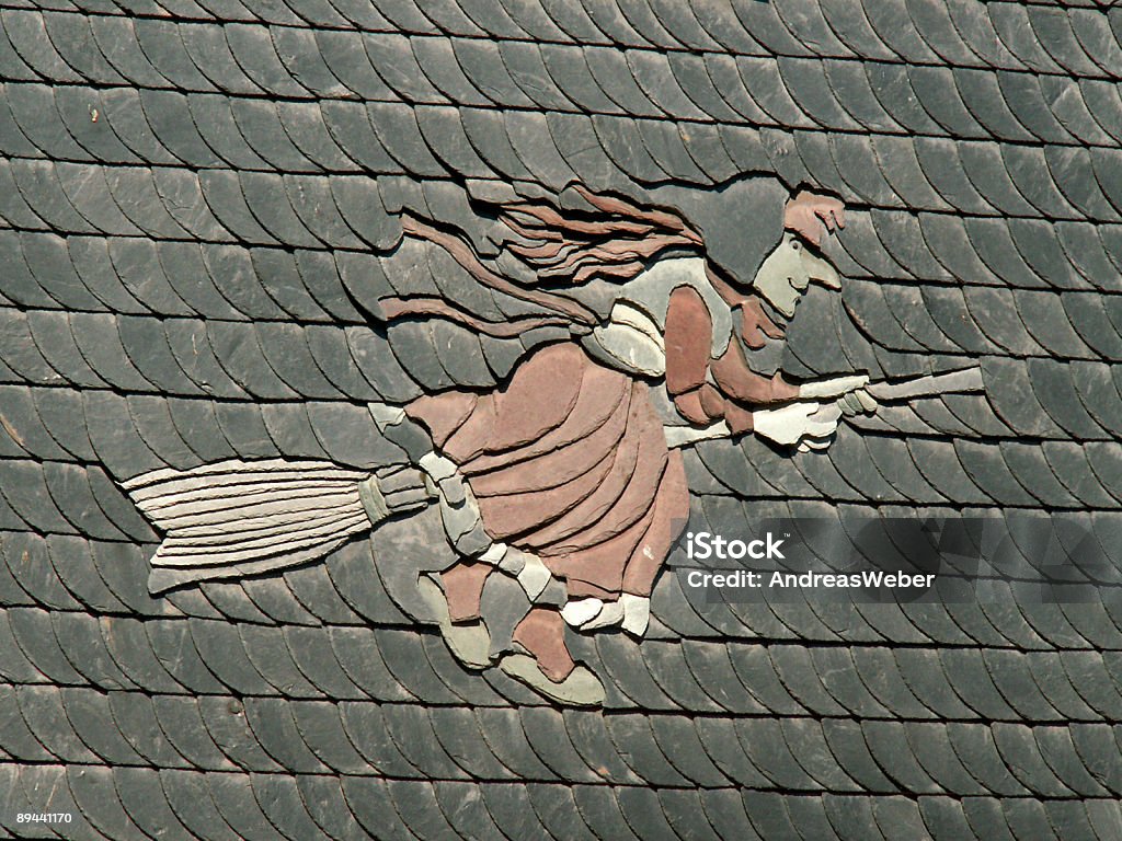 Harz witch on house wall in Schiefer  Rooftop Stock Photo